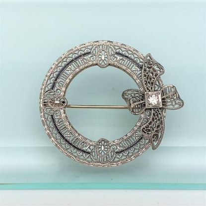 Picture of Art Deco Era 14K White Gold Filigree, Diamond & Blue Enamel Wreath Brooch With Bow Detail
