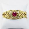 Picture of 18K Yellow Gold Hinged Bangle Bracelet with Solitaire Synthetic Ruby Accent 