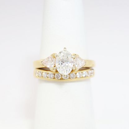 Picture of 14k Yellow Gold, Oval Brilliant Cut & Diamond Cluster Accented Two-Piece Bridal Ring Set