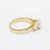 Picture of 14k Yellow Gold, Oval Brilliant Cut & Diamond Cluster Accented Two-Piece Bridal Ring Set