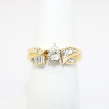 Picture of 14K Yellow Gold, Pear Brilliant Cut Diamond Solitaire & Diamond Cluster Accented Two-Piece Bridal Ring Set