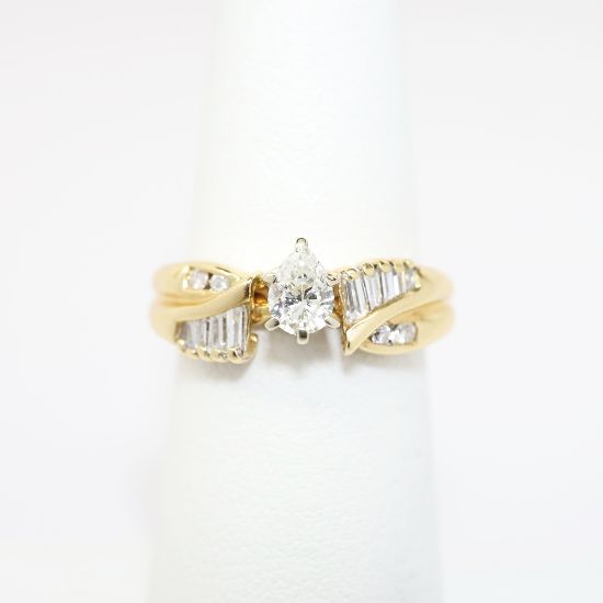 Picture of 14K Yellow Gold, Pear Brilliant Cut Diamond Solitaire & Diamond Cluster Accented Two-Piece Bridal Ring Set