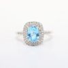 Picture of Blue Topaz ring with Diamond Halo in 10k White Gold
