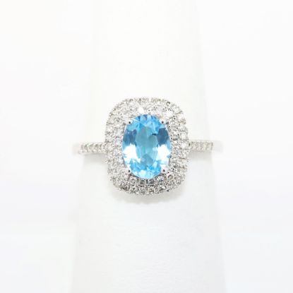 Picture of Blue Topaz ring with Diamond Halo in 10k White Gold