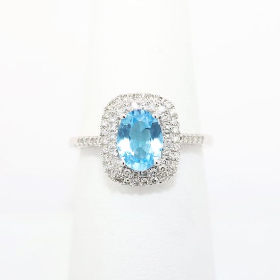 Picture of Blue Topaz ring with Diamond Halo in 10k White Gold