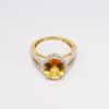 Picture of 14k Two-Tone 3.00ct Oval Cut Citrine Ring with Diamond Halo