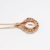 Picture of 14k Rose Gold & 2.00ct Oval Cut Morganite Pendant Necklace with Diamond and Garnet Halo