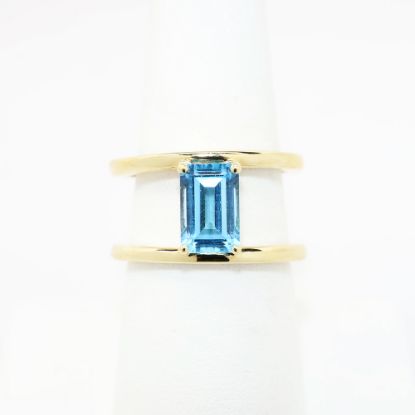 Picture of 14k Yellow Gold & Emerald Cut Blue Topaz Ring with Split Shank