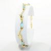 Picture of 14k Yellow Gold & Oval Cut Blue Topaz Bracelet with Dolphin Shaped Links