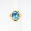 Picture of 18k Yellow Gold & Bezel Set Oval Cut Blue Topaz Ring