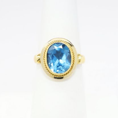 Picture of 18k Yellow Gold & Bezel Set Oval Cut Blue Topaz Ring