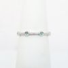 Picture of 10k White Gold Petite Diamond Band Ring with Emeralds