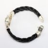 Picture of AXION Men's Braided Black Leather & Sterling Silver Bracelet with 14k Yellow Gold Skull & Crossbones  