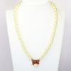 Picture of Heidi Daus 'Exquisite Harmony' Faux Pearl & Red Crystal Bow Necklace