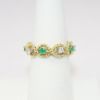 Picture of 18k Yellow Gold Woven Rope Ring with Emerald and Diamond Accents