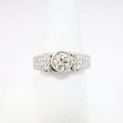 Picture of 18k White Gold Round Brilliant Cut Diamond Ring with Pavé Set Diamond Band