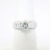 Picture of 14k White Gold & Round Brilliant Cut Diamond Solitaire Ring with Baguette Cut Accents