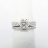 Picture of Platinum & Round Brilliant Cut Diamond Solitaire Bridal Ring Set with Channel Set Diamond Bands