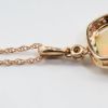 Picture of 14k Rose Gold Necklace and Opal Cabochon Pendant with Diamond Halo