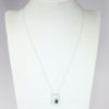 Picture of 14k White Gold Necklace with Baguette Cut Emerald Pendant with Geometric Diamond Halo