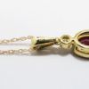 Picture of 14k Yellow Gold Necklace with Oval Cut Ruby Pendant with Diamond Accent