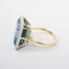 Picture of 14k Yellow Gold & Emerald Cut Blue Topaz Ring with a Sky Blue Enamel Halo