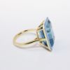 Picture of 14k Yellow Gold & Emerald Cut Blue Topaz Ring with a Sky Blue Enamel Halo