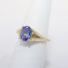 Picture of 14k Yellow Gold & Oval Cut Tanzanite Ring with Diamond Accented Band