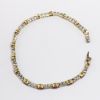 Picture of 18k Two-Tone Gold, Oval Cut Ruby & Round Cut Diamond Tennis Bracelet