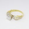 Picture of 18k Yellow Gold & Round Brilliant Cut Diamond Engagement Ring with Baguette  & Round Cut Accents