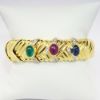 Picture of 18k Braided Yellow Gold, Emerald, Ruby, & Sapphire Cuff Bracelet with Diamond Accents