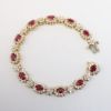 Picture of 14k Yellow Gold, Oval Cut Ruby & Diamond Bracelet