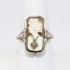 Picture of Antique Art Deco 14k White Gold Filigree Flip Ring, Cameo on One Side, Synthetic Emeralds on the Other