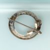 Picture of Art Deco Era 14K White Gold Filigree, Diamond & Sapphire Wreath & Bow Brooch