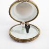 Picture of Limoges Porcelain Chocolate Anniversary Cake with Pink Icing Trinket Box with Bride & Groom Inside