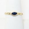 Picture of 14k Yellow Gold Curved Oval Blue Sapphire Ring